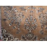 Persian floor rug decorated with floral sprays upon a brown ground, 265 x 150 cm