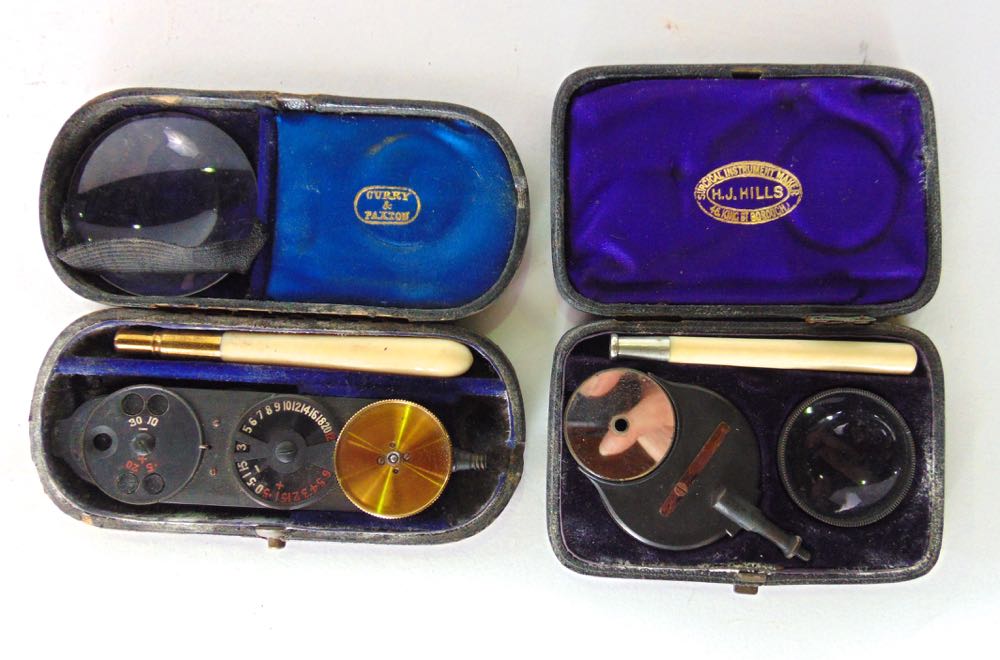 Two small cased pieces of optical equipment, one inscribed 'D De Weckr's Ophthalmoscope' together