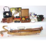 A big mixed miscellaneous lot to include fabric, horns, walking stick, antlers, cameras,