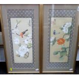 A pair of framed oriental studies of birds and flowering trees, together with a further pair of