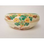 A Newport Pottery Clarice Cliff Bizarre bowl of curved form with painted green and yellow floral and