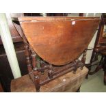 A good quality old English style gate leg table with figured top raised on eight baluster supports