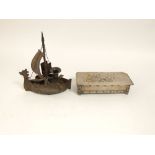 Attributed to Goberg, an Arts & Crafts candlestick and vesta box holder in the form of a Viking ship