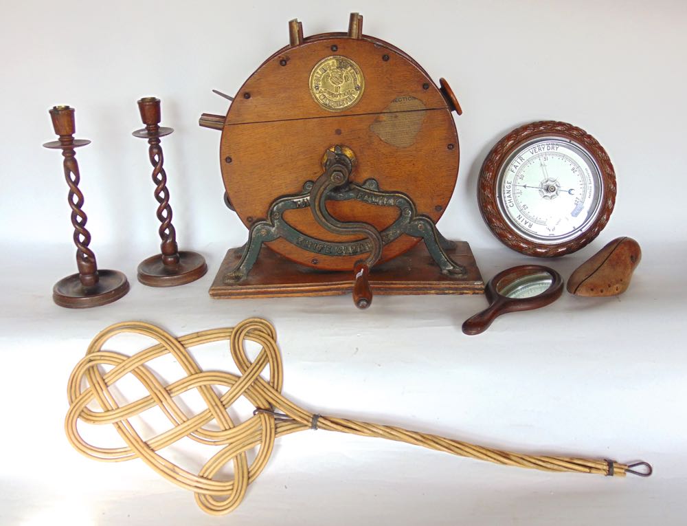 A Victorian oak table knife sharpener together with a pair of open barley twist candlesticks, an