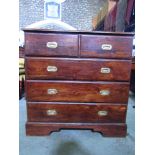 A teak wood chest of three long and two short drawers with flush fitting brass handles.