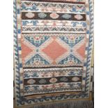Afghan type floral runner decorated in relief with medallion type panels, 190 x 62 cm