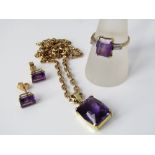 A group of amethyst jewellery comprising 18ct diamond ring, size R/S, 18ct stud earrings and 9k