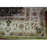 A bright Eastern wool carpet, the pale green ground within white ground borders with overall multi-