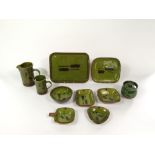 A collection of pottery wares by Dieter Kunzemann, all with olive green glaze and painted stylised