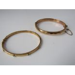 Two 9ct gold bangles, one set with white stones and the other with faceted decoration and safety