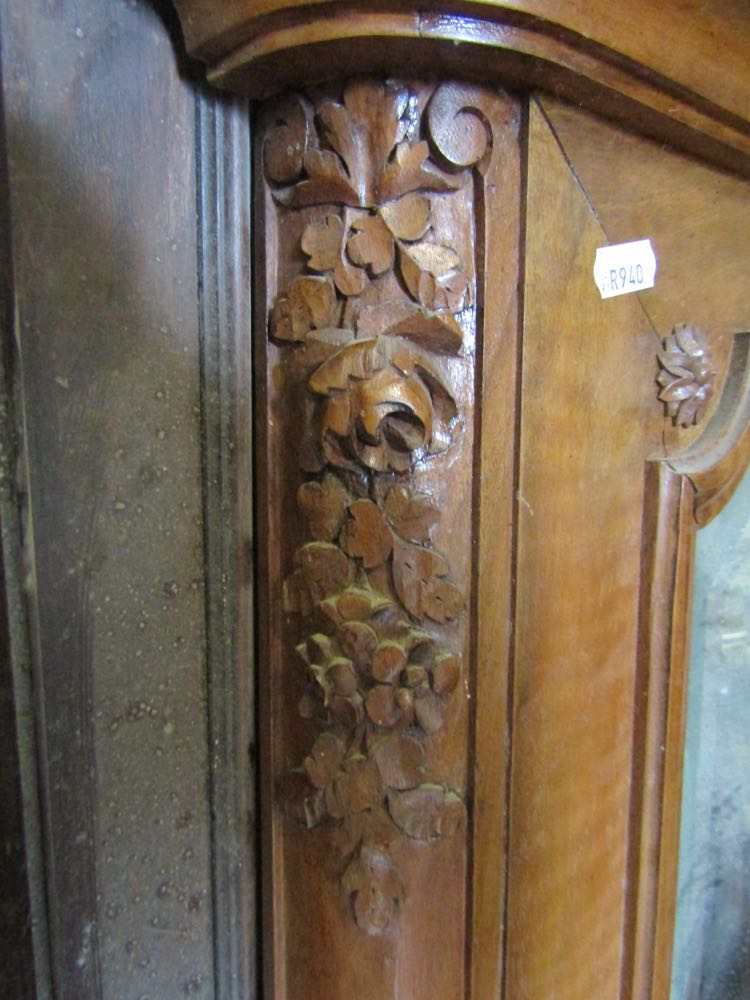 A late 19th century wall mirror the walnut frame with shaped outline and trailing floral detail - Image 2 of 2