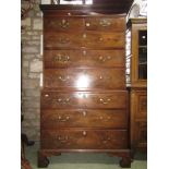 A Georgian mahogany chest on chest. Six long and two short drawers beneath a Greek key frieze. 105cm