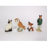 A collection of Beswick animals including a model of a large headed seated fox, a seated Siamese cat