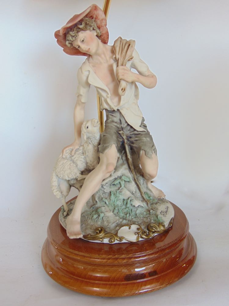 Three various figural porcelain table lamps, one modelled as a seated pauper boy, the other with - Image 3 of 5