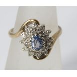 A topaz and diamond cluster 9ct twist ring, size K/L, 3g