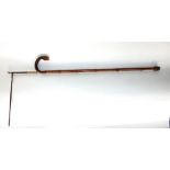 A good and interesting horse measuring stick with crooked knobbly handle and silver hinged mount