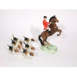 A Beswick model of a huntsman on a rearing horse with impressed number to base 868 and printed