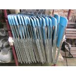 Thirty nine folding pop chairs with light blue coloured moulded plastic seats and back rails