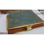 A late 19th century leather bound album with brass edging and clasp containing a collection of
