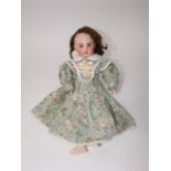 An antique S. F. B. J. porcelain headed doll 18 inches long with shutting eyes open mouth and