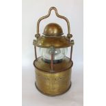 A good cast brass and glass storm lamp, 40 cm high approx.