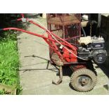 A Wolseley Merry Tiller garden rotavator with Briggs & Stratton 5 HP engine together with various