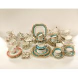 A quantity of Aynsley tea wares with gilt border decoration on a turquoise ground comprising pair of