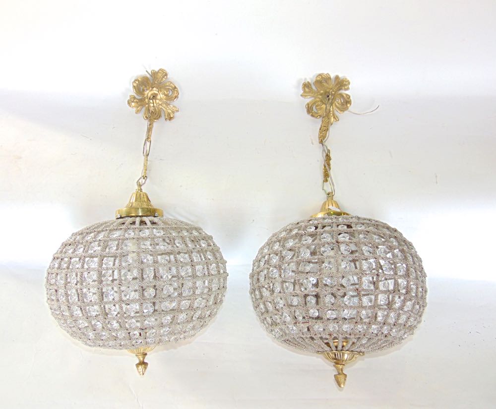 A pair of contemporary French Empire style spherical ceiling lights with geometric prismatic drop
