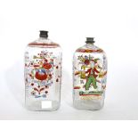 Matched pair of antique continental hand painted glass decanters, one decorated with a floral