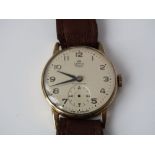A Smiths Deluxe gold gents wristwatch with subsidiary second dial and leather strap.
