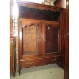 An oak side cupboard enclosed by two glazed panel doors a frieze drawer and an open alcove with