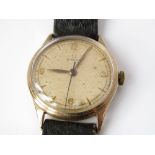 A 1960s Omega 9ct 17 jewel gents wristwatch upon a leather strap.