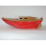 A vintage wooden cabin cruiser inscribed 'Girasole' with red painted body, 90 cm long approx.