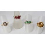 A 14k pink and white stone ring, together with a yellow metal ring of stylised design, a green and