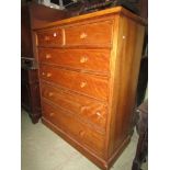 A late 19th century satin birch bedroom chest of four long and two short graduated drawers