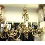 Fine quality heavy cast brass fifteen branch chandelier, the central column with pierced scroll