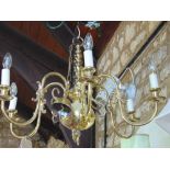 Four similar Dutch type brass ceiling lights, each with scrolled scones and globular stems (4)