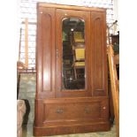Victorian wardrobe with mirror panel door over a single frieze drawer together with an Edwardian