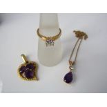 A 9ct gold necklace with amethyst drop pendant, another 9ct pendant with 3 amethysts and a yellow