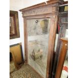 A large late 19th century wall mirror walnut frame with moulded detail, car frieze a pair of