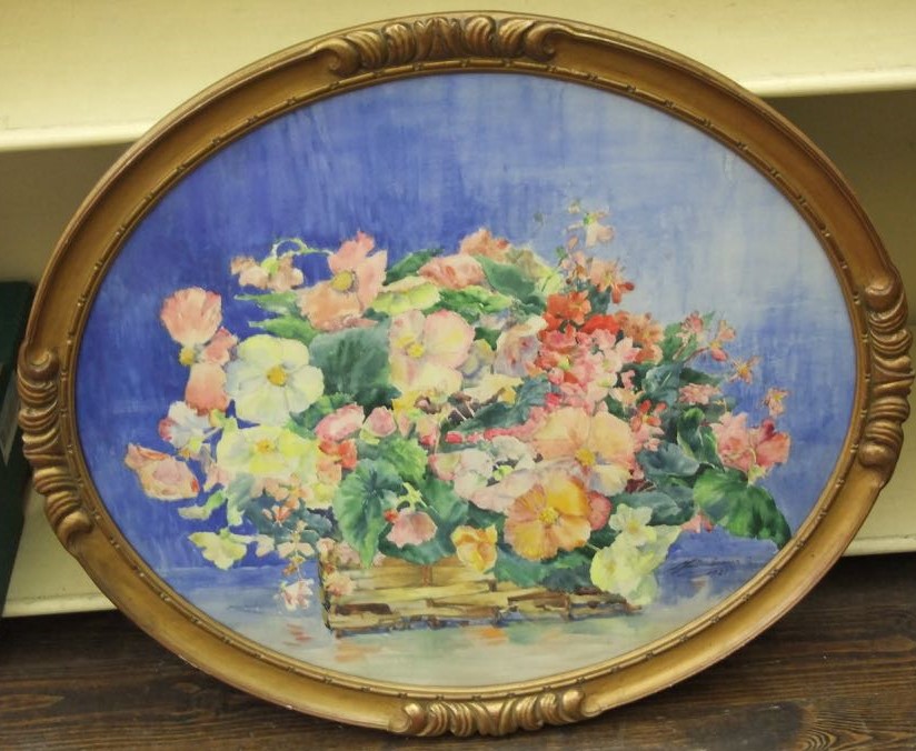 A 20th century watercolour study of oval form showing a still life with basket of flowers, signed