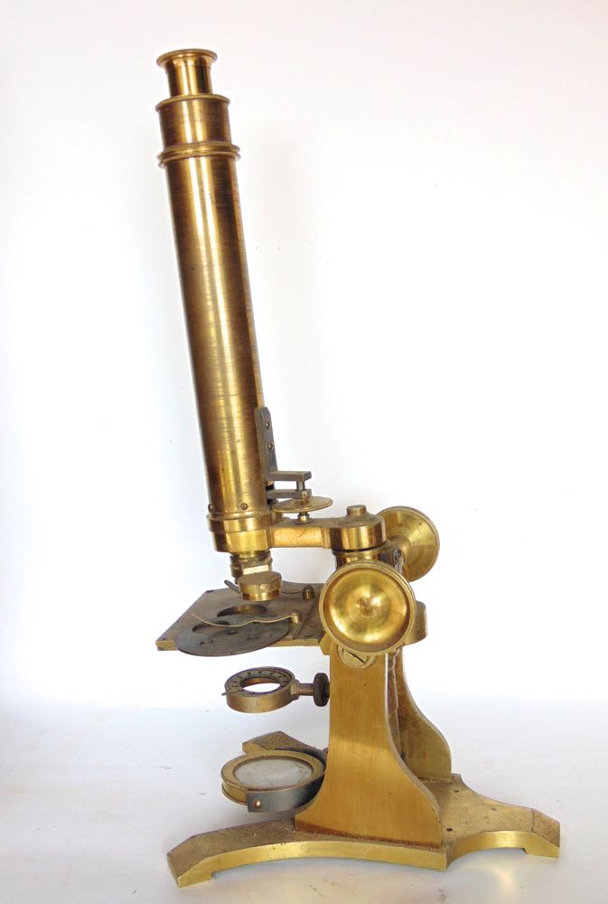 A good mahogany cased lacquered brass monocular microscope, the case fitted with further lenses,