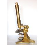 A good mahogany cased lacquered brass monocular microscope, the case fitted with further lenses,