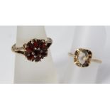 A garnet flower head ring in 9ct gold with scrolling engraved detail, size N/O, together with an