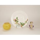 A Royal Worcester plate with relief moulded and painted rose branch detail and printed and impressed