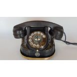 A good vintage telephone with brass carry handle and gilt decoration.