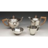 Attractive silver four piece tea service comprising tea pot, water jug, milk jug and sucrier, each