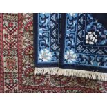 Bokhara style floor rug with typical geometric decoration upon cream ground; together with two