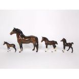 A collection of Beswick horses, all with brown finish, comprising a standing horse, a shetland