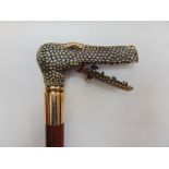 An interesting novelty walking stick, the handle in the form of a crocodile head with hinged jaw and